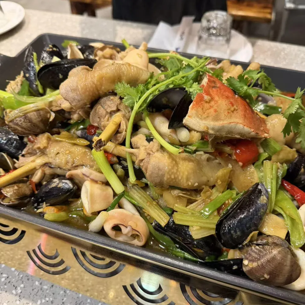 Braised seafood and chicken mixed with celery and chili at Xu's grill, a Chinese Restaurant in Flushing