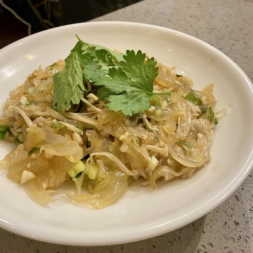 Cold jellyfish shred salad topped with fresh coriander at Xu's grill, a Chinese Restaurant in Flushing