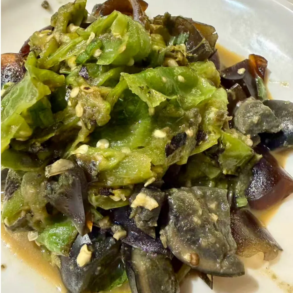 Mashed green chili mixed with preserved egg cubes at Xu's grill, a Chinese Restaurant in Flushing