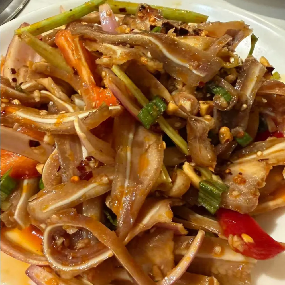 Spicy shredded pig ear mixed with vegetable sticks at Xu's grill, a Chinese Restaurant in Flushing