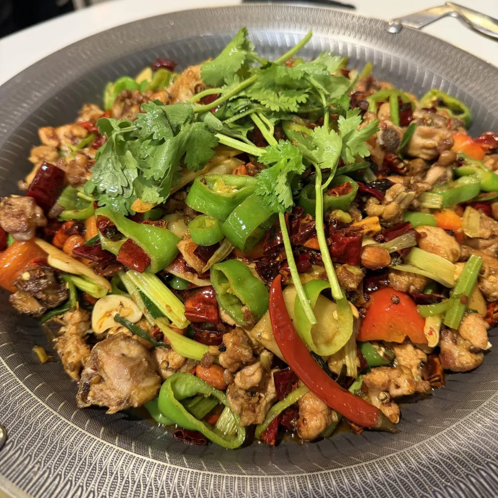 Stir-fried spicy diced chicken with chili peppers and coriander at Xu's grill, a Chinese Restaurant in Flushing